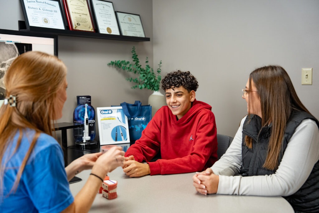 Patient discussing treatment options with a Lincoln orthodontist.
