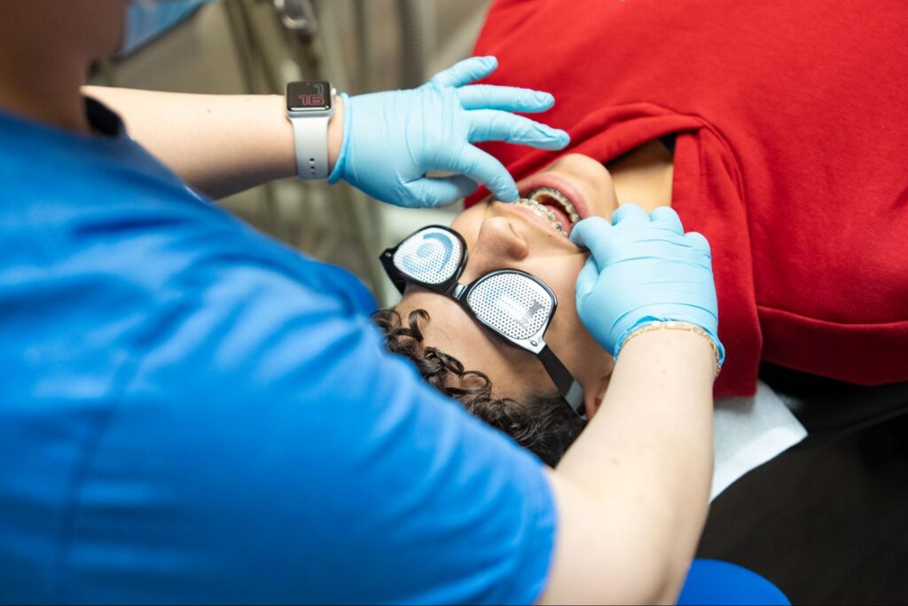 Patient with braces from a Lincoln orthodontist.